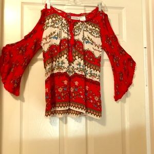 Red and white floral blouse